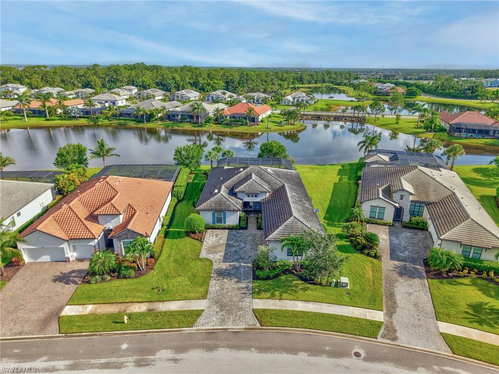 2079 Antigua Lane Naples, FL 34120 - Photo 5 of 44 Aerial view of residential area featuring a nearby body of water