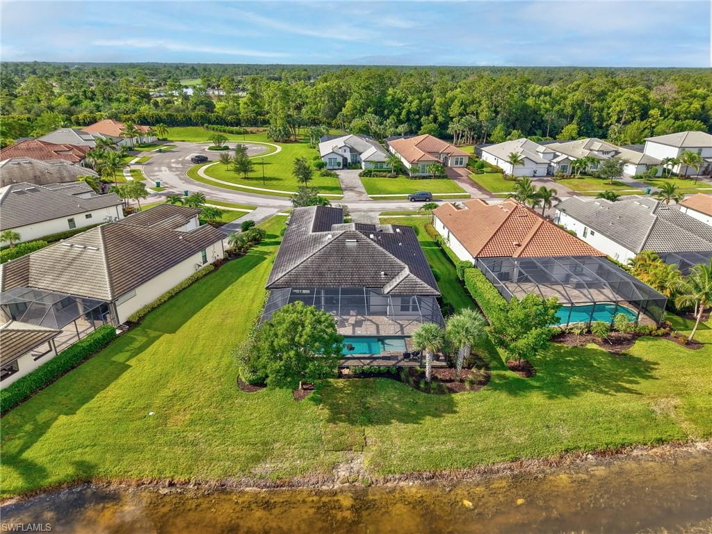 2079 Antigua Lane Naples, FL 34120 - Photo 6 of 44 Aerial perspective of suburban area featuring a pool