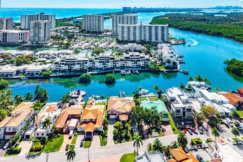 a view of a lake with a table and a chairs