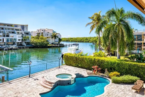 a view of a lake with couches and city view