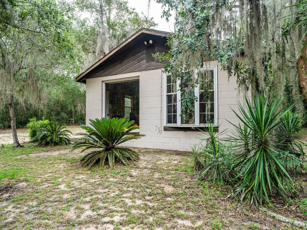 13668 Northeast 226th Avenue Road Fort McCoy, FL 32134 - Photo 20 of 37 a view of a house with a yard