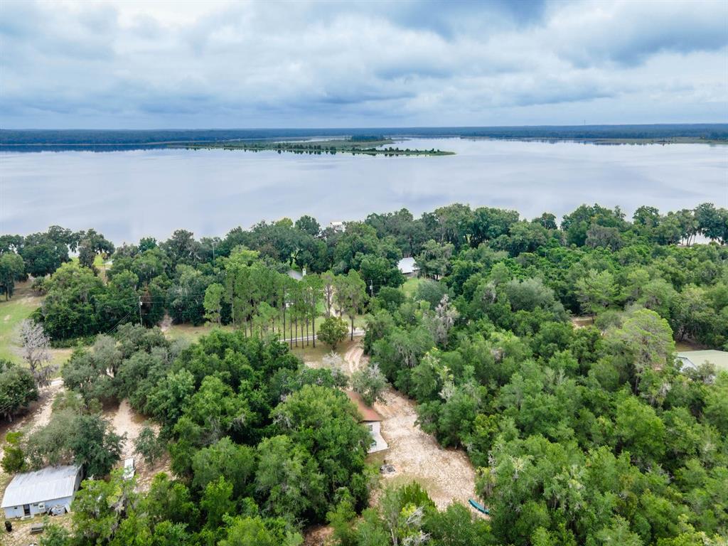 13668 Northeast 226th Avenue Road Fort McCoy, FL 32134 - Photo 32 of 37 a view of a lake from a yard