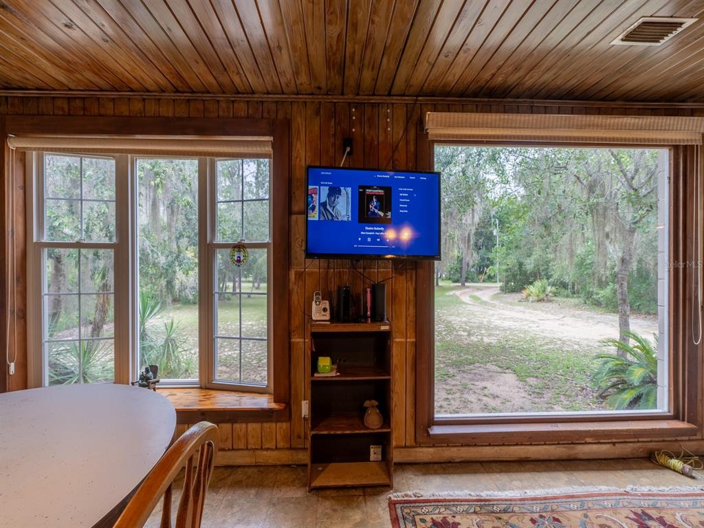 13668 Northeast 226th Avenue Road Fort McCoy, FL 32134 - Photo 7 of 37 a room with furniture and a large window