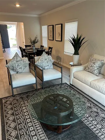 a living room with furniture and a rug