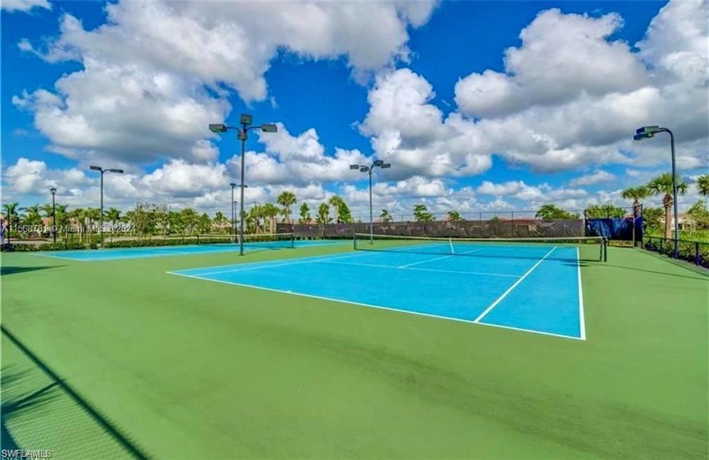 2876 Citrus Street Naples, FL 34120 - Photo 14 of 16 a view of a golf course with a lake