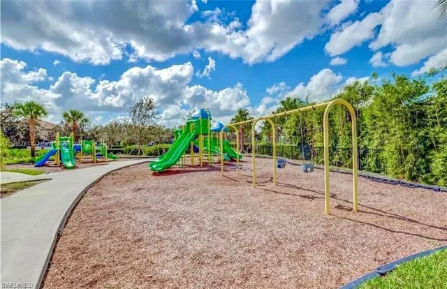 a view of a swimming pool with a yard