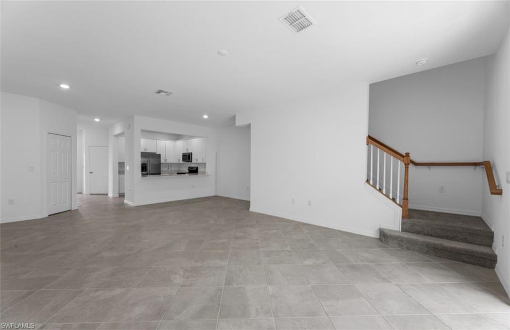 2876 Citrus Street Naples, FL 34120 - Photo 6 of 16 a view of a hallway with stairs