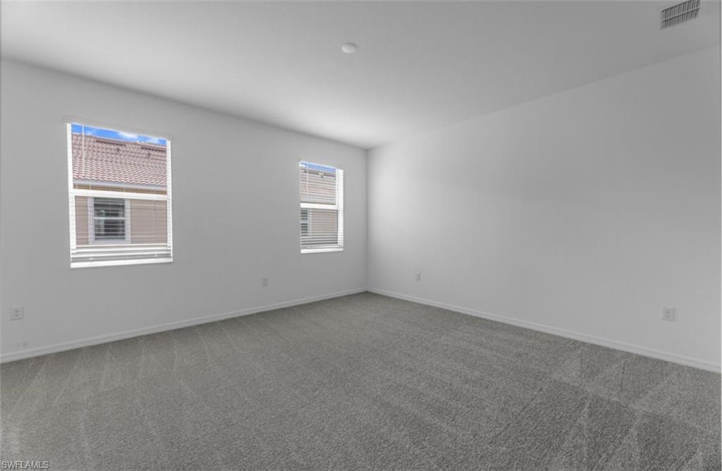 2876 Citrus Street Naples, FL 34120 - Photo 7 of 16 an empty room with windows