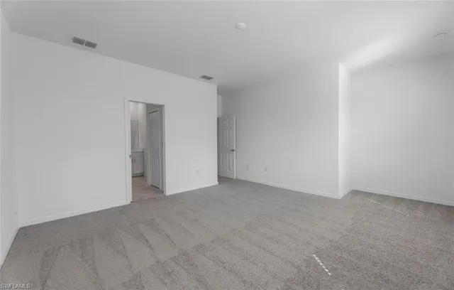 a bathroom with a double vanity sink a mirror and a bathtub