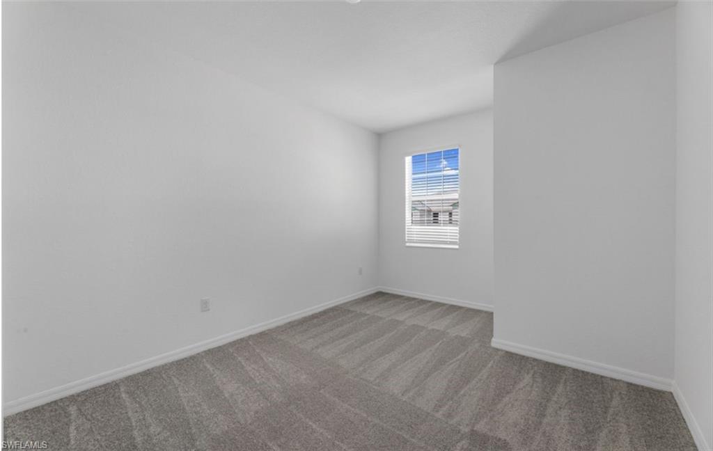 2876 Citrus Street Naples, FL 34120 - Photo 10 of 16 an empty room with windows