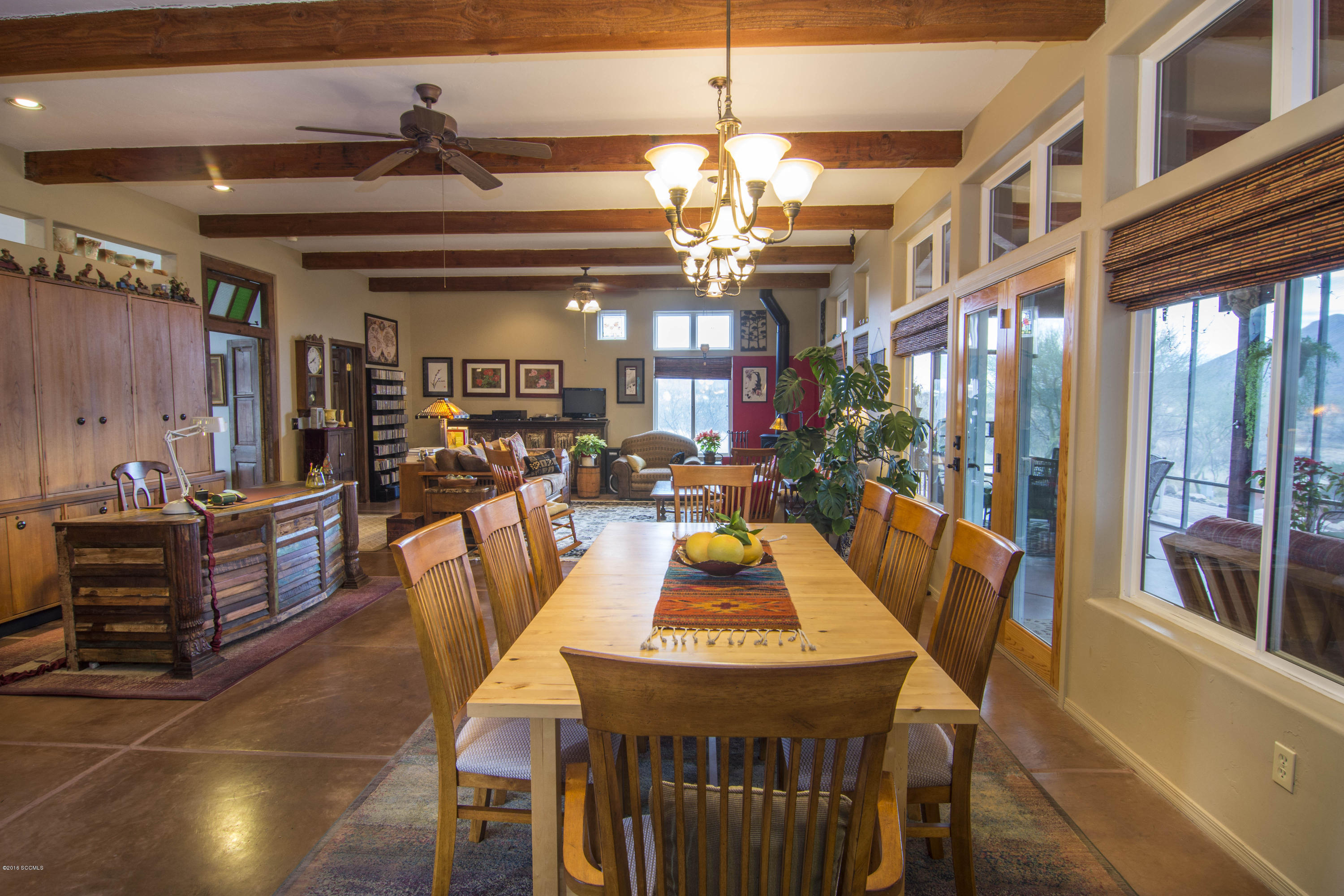 66 Camino Nacozari Rio Rico, AZ 85648 - Photo 25 of 55 a view of a dining room with furniture window and wooden floor