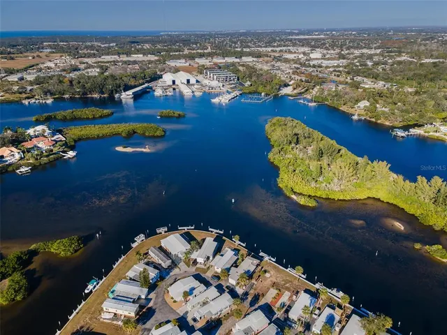 a view of a lake with a house in the background