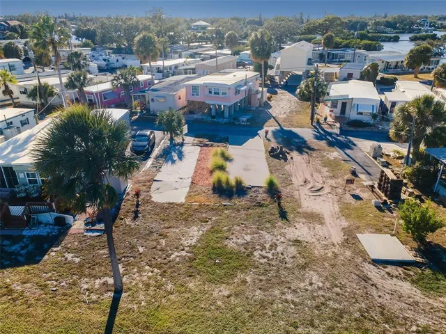an aerial view of a house with a ocean view
