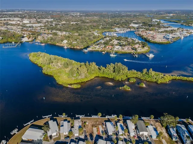 an aerial view of a house with a lake view