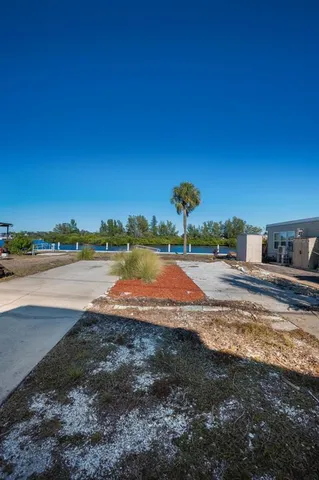 an aerial view of a houses with a yard