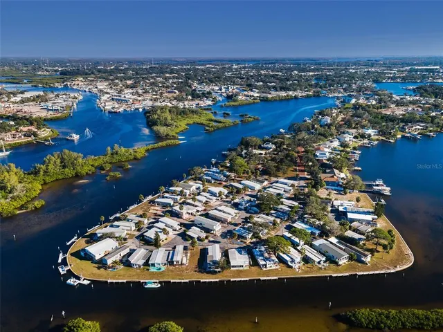 a view of a house with barbeque grill and wooden floor