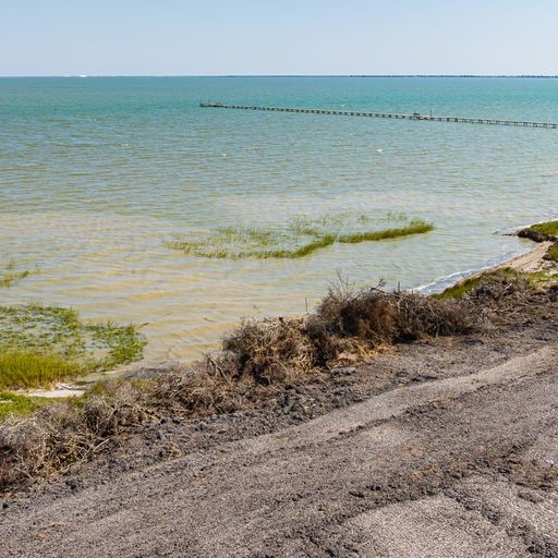 2415 1st Street Bayside, TX 78340 - Photo 9 of 18 a view of a ocean with a large mountain