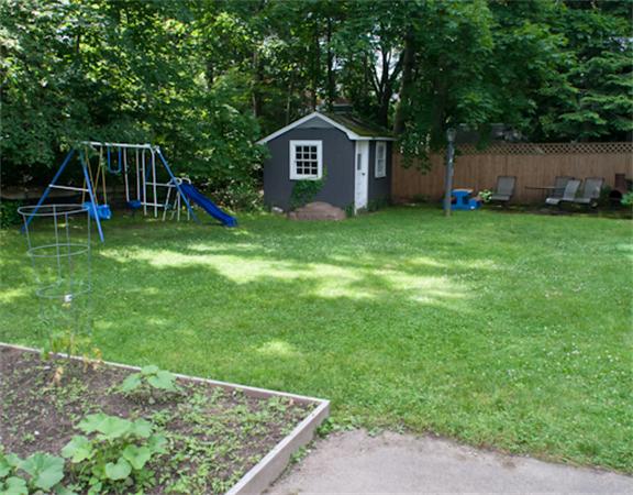 28 Manemet Road Newton, MA 02459 - Photo 15 of 15 a front view of a house with garden