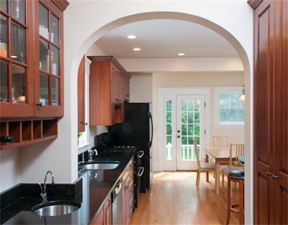 28 Manemet Road Newton, MA 02459 - Photo 7 of 15 a kitchen with stainless steel appliances granite countertop a stove refrigerator and a dining table with wooden floor