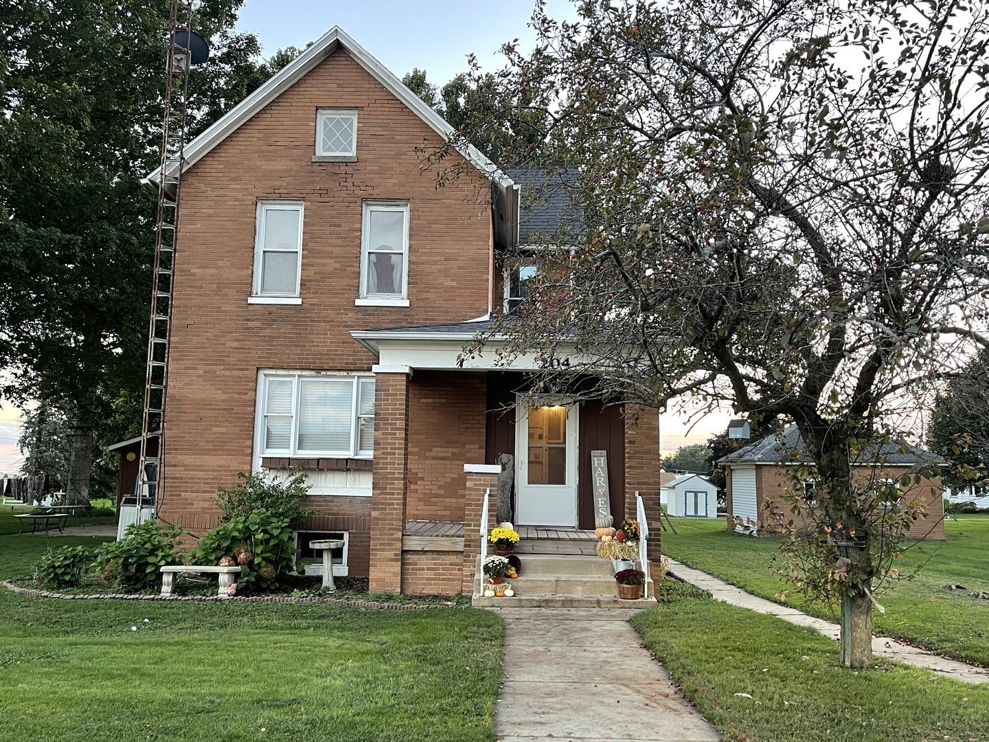 204 Locust Street Sublette, IL 61367 - Photo 1 of 17 a front view of a house with garden