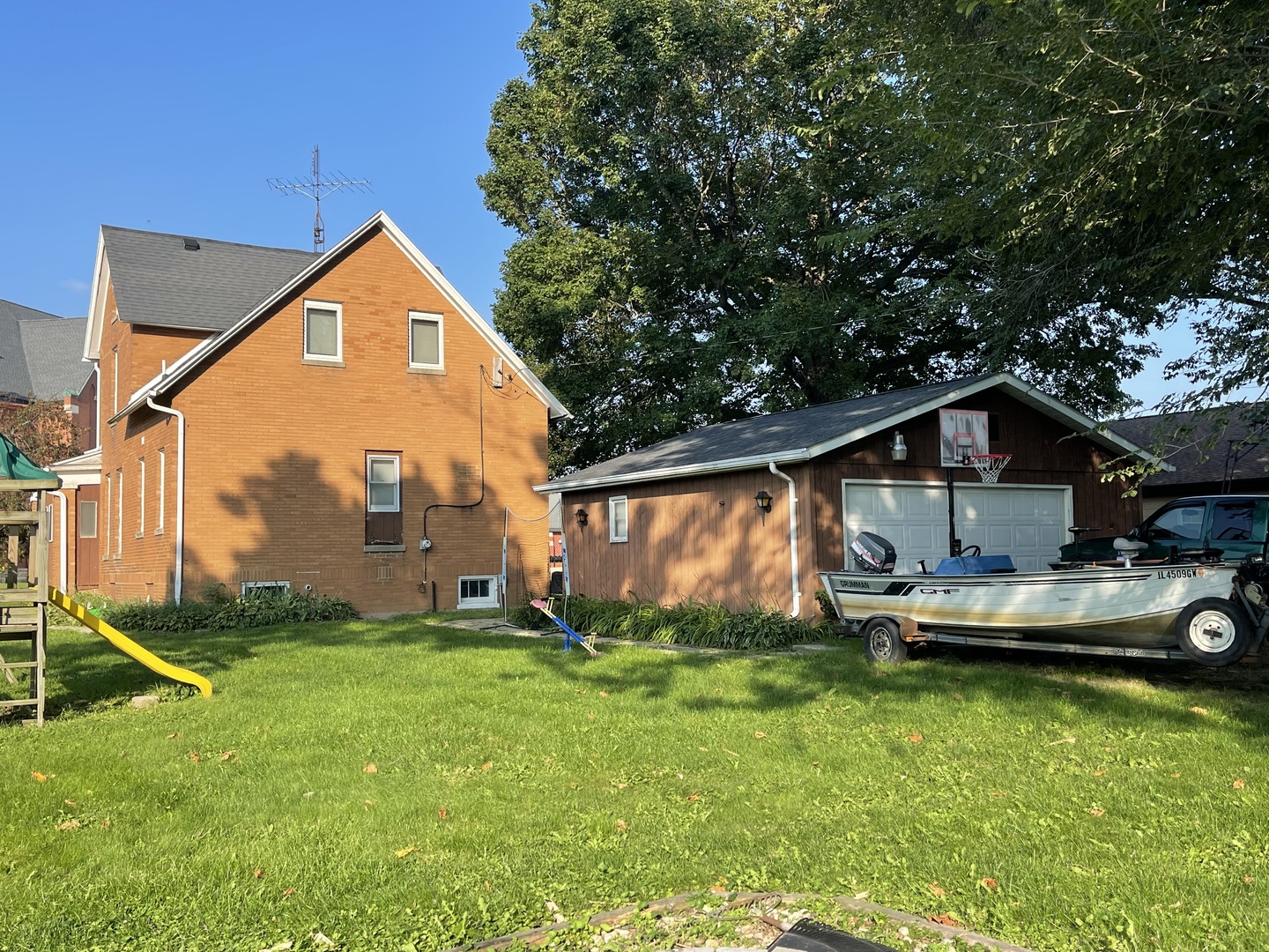 204 Locust Street Sublette, IL 61367 - Photo 3 of 17 a front view of a house with a yard table and chairs