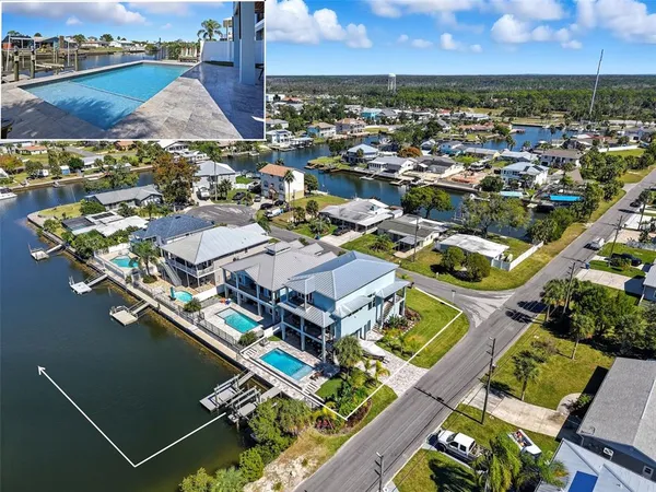 an aerial view of a house with a ocean view