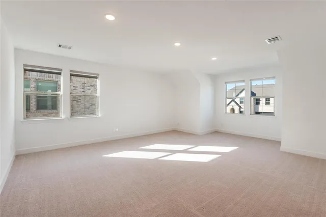 a view of room with hardwood floor and cabinet