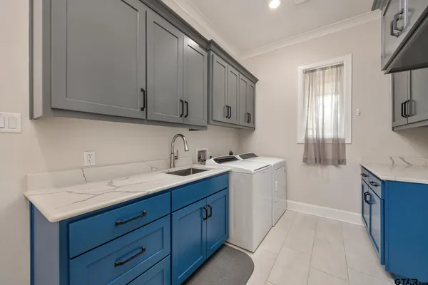 a kitchen with a sink and cabinets