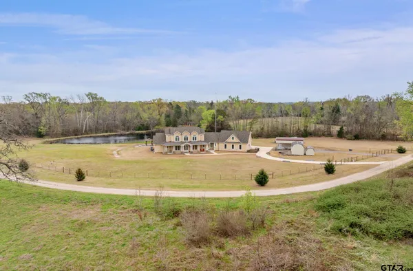 a view of a swimming pool and trees