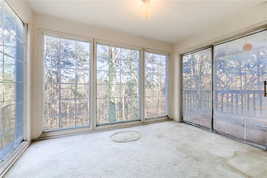 302 Countryside Place Smyrna, GA 30080 - Photo 3 of 19 a view of an empty room with windows