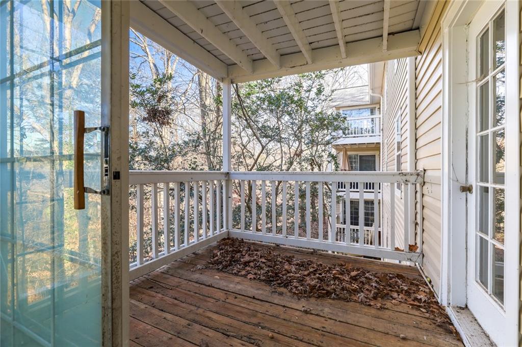 302 Countryside Place Smyrna, GA 30080 - Photo 4 of 19 a view of a porch with wooden floor