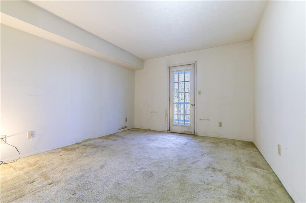 302 Countryside Place Smyrna, GA 30080 - Photo 8 of 19 an empty room with windows