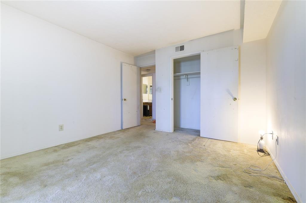 302 Countryside Place Smyrna, GA 30080 - Photo 9 of 19 a view of an empty room with closet and a window