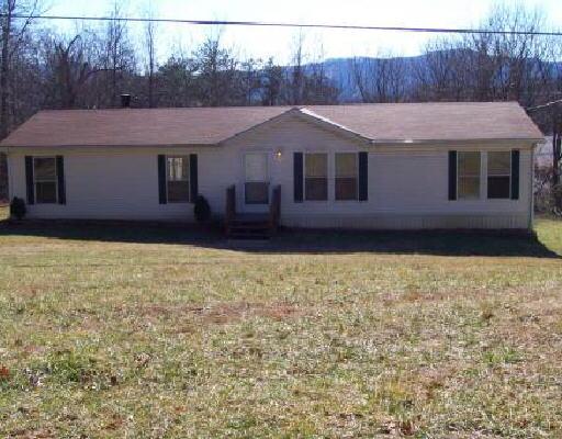 3021 Rutrough Road Southeast Roanoke, VA 24014 - Photo 1 of 1 a front view of a house with a yard