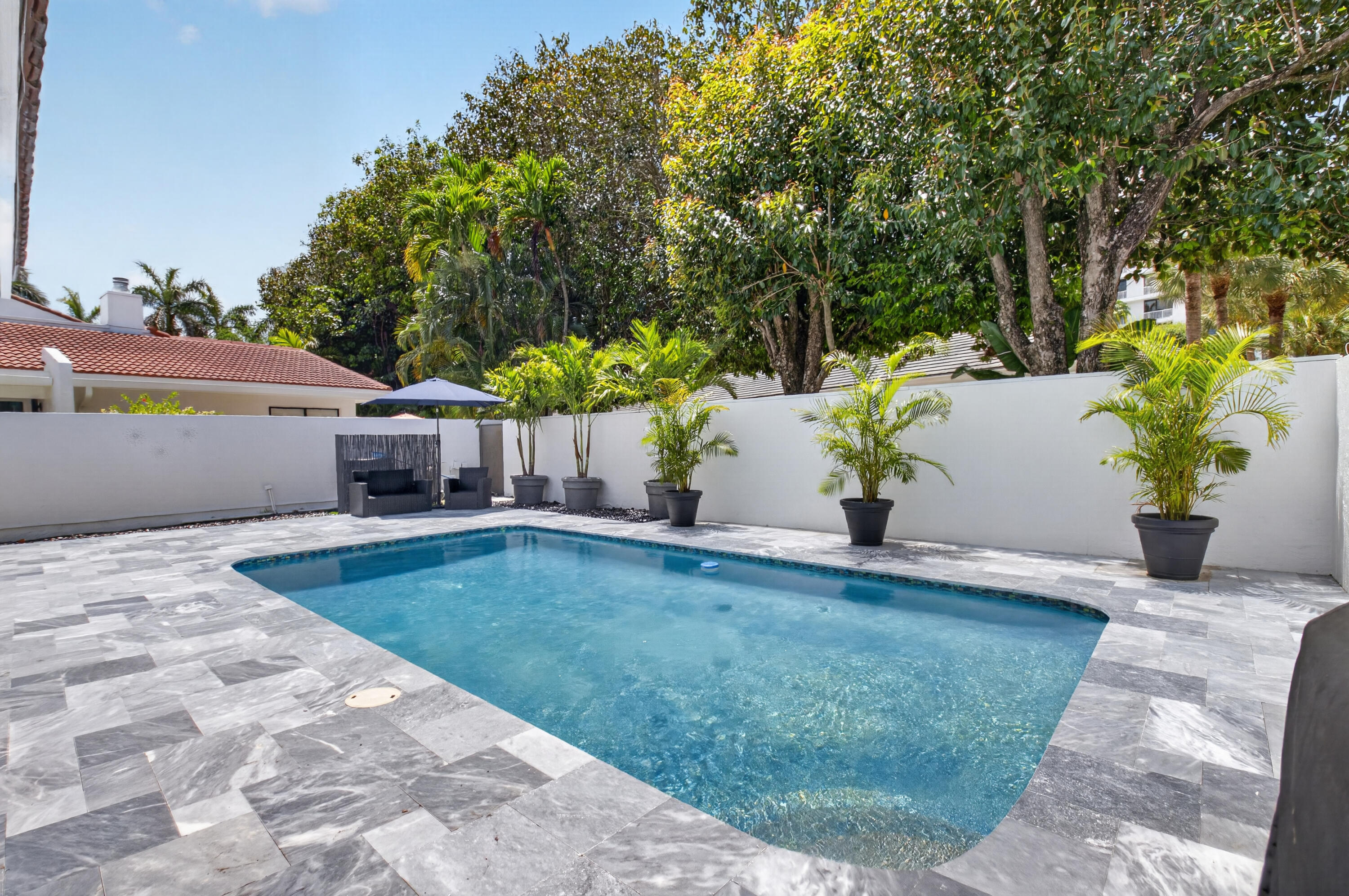 7374 Woodmont Court Boca Raton, FL 33434 - Photo 40 of 95 a view of a backyard