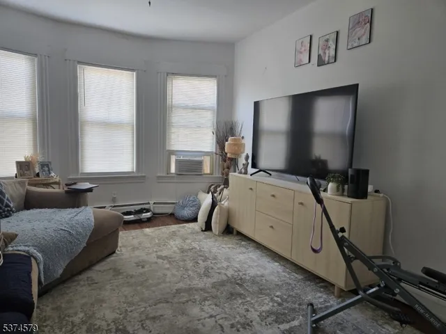 a room with furniture and a flat screen tv