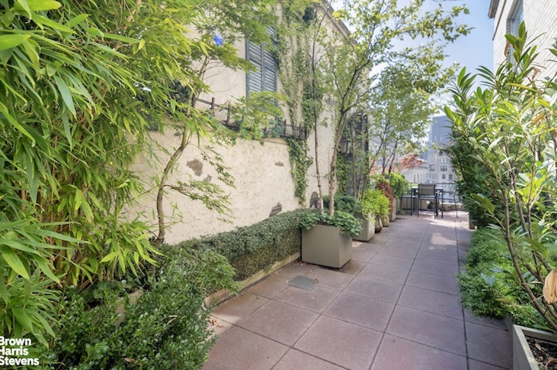 3 East 71st Street, Unit 11/12C Manhattan, NY 10021 - Photo 9 of 14 a view of a garden with plants