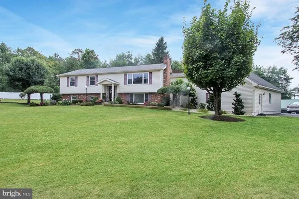 a front view of house with yard and seating area