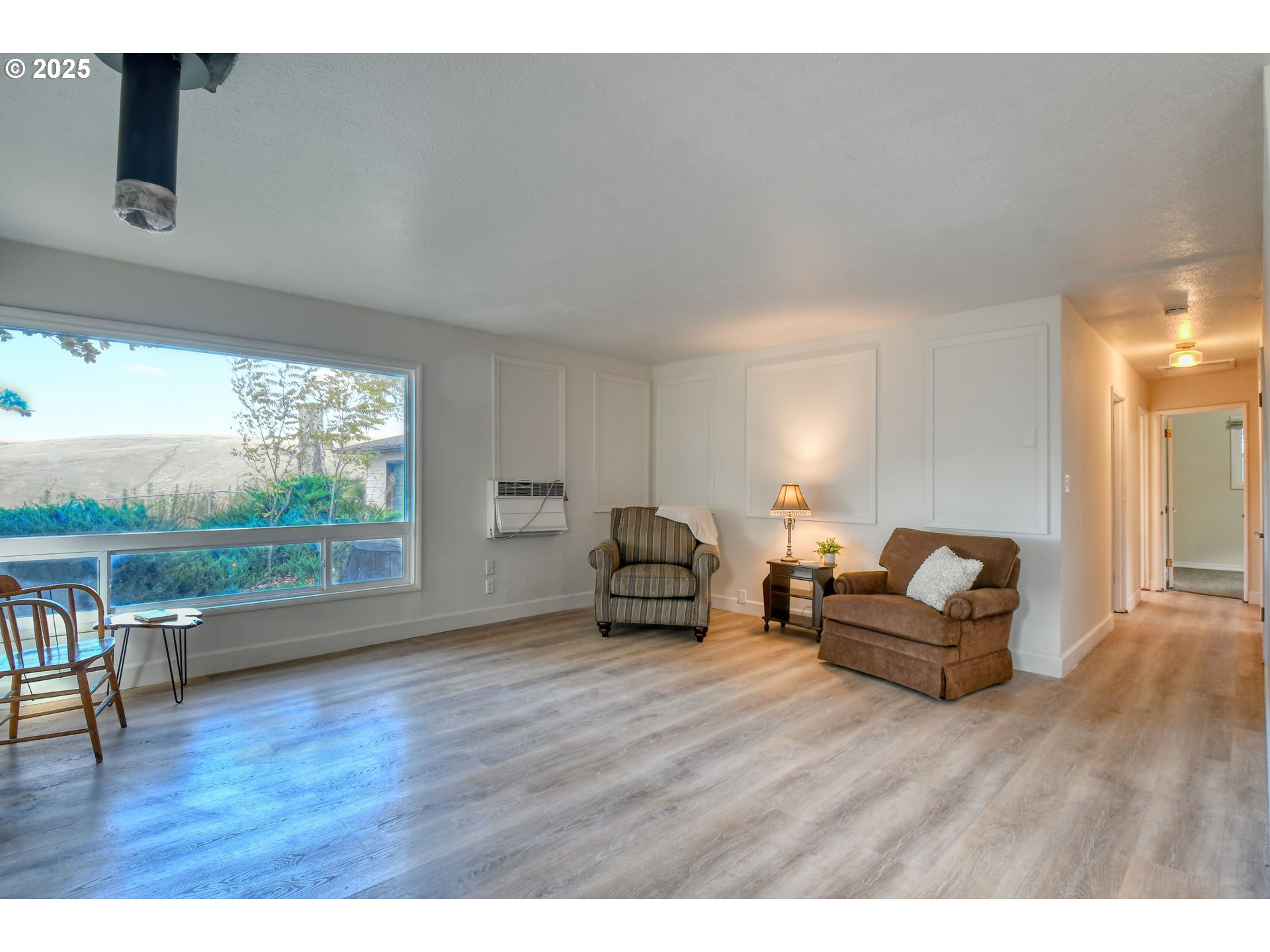 20 Northeast Nelson Drive Pendleton, OR 97801 - Photo 13 of 35 a living room with furniture and a floor to ceiling window