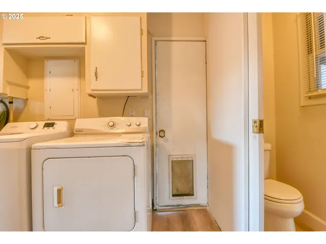 a utility room with dryer and washer