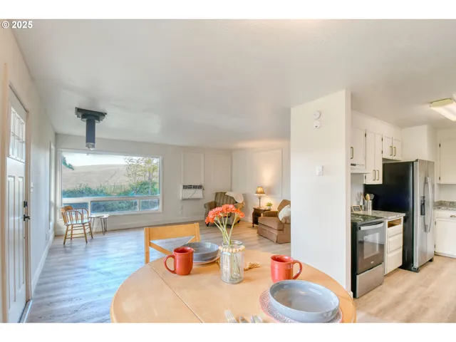 a kitchen with stainless steel appliances wooden cabinets and refrigerator