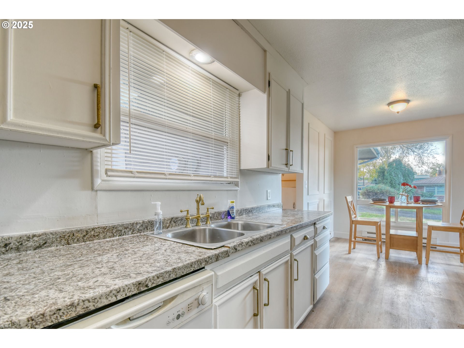 20 Northeast Nelson Drive Pendleton, OR 97801 - Photo 9 of 35 a kitchen with a sink a counter top space and cabinets