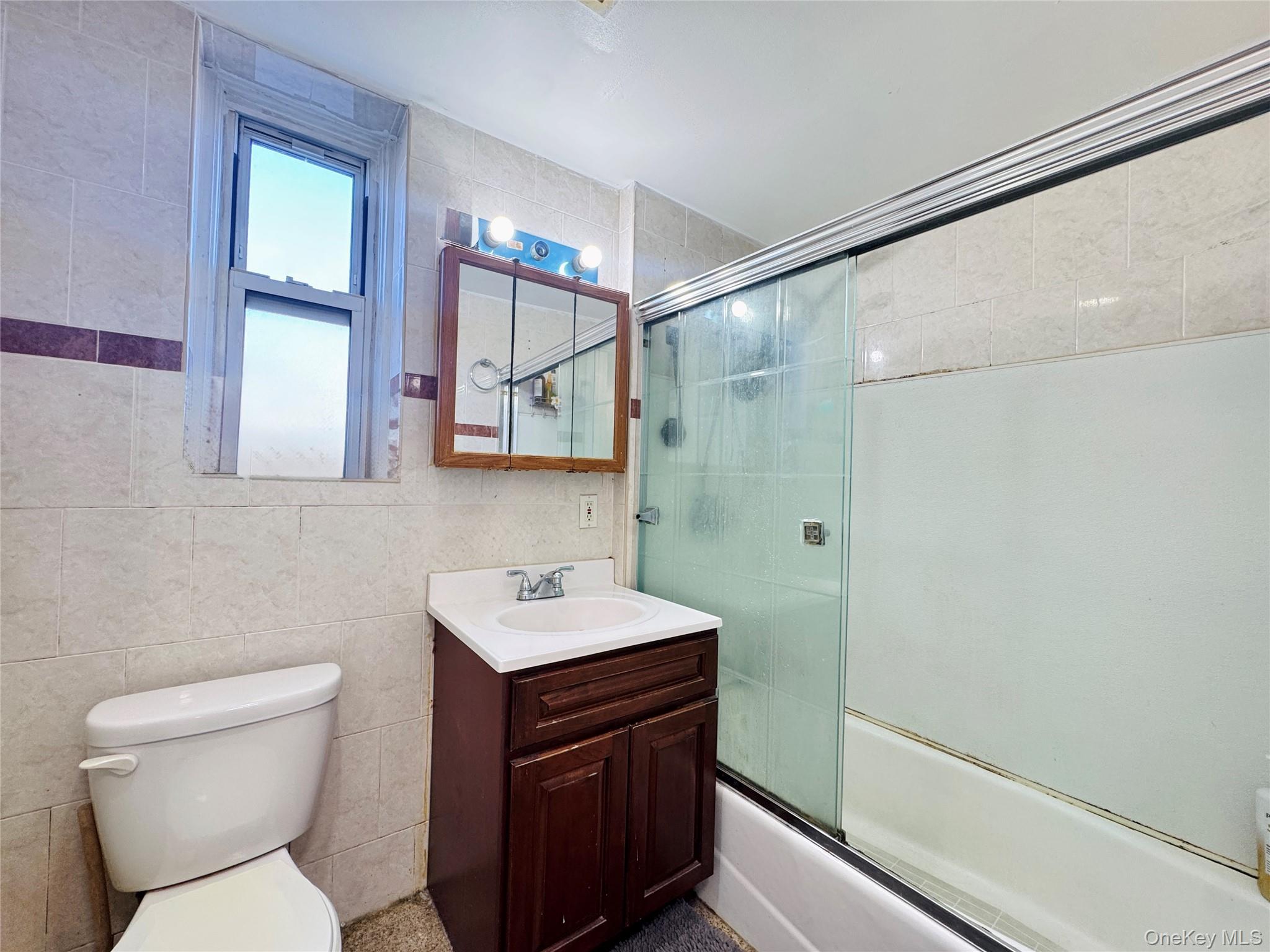 4232 82nd Street, Unit 6B Queens, NY 11373 - Photo 10 of 10 a bathroom with a sink toilet and shower