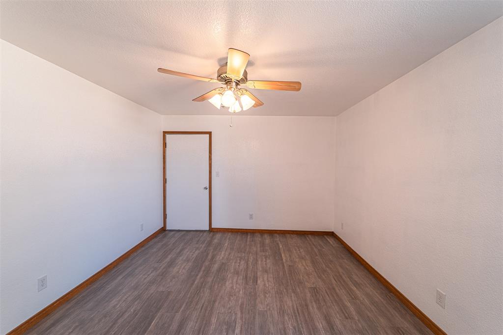 618 Oak Street Clyde, TX 79510 - Photo 16 of 39 wooden floor in an empty room