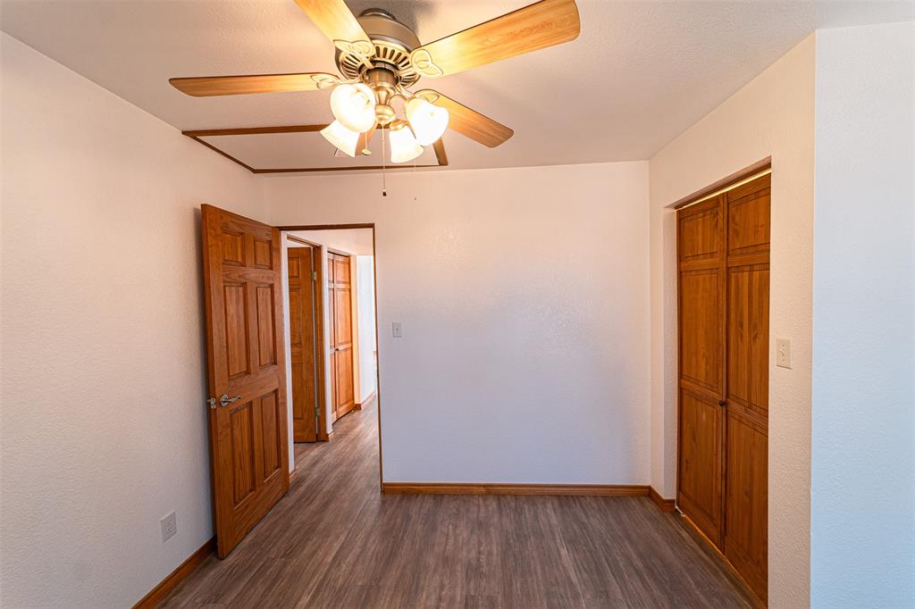 618 Oak Street Clyde, TX 79510 - Photo 25 of 39 a view of a hallway with wooden floor