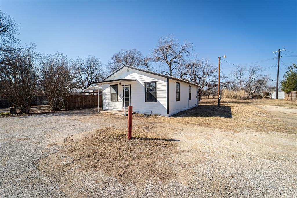 618 Oak Street Clyde, TX 79510 - Photo 32 of 39 a view of a house with a yard covered in snow
