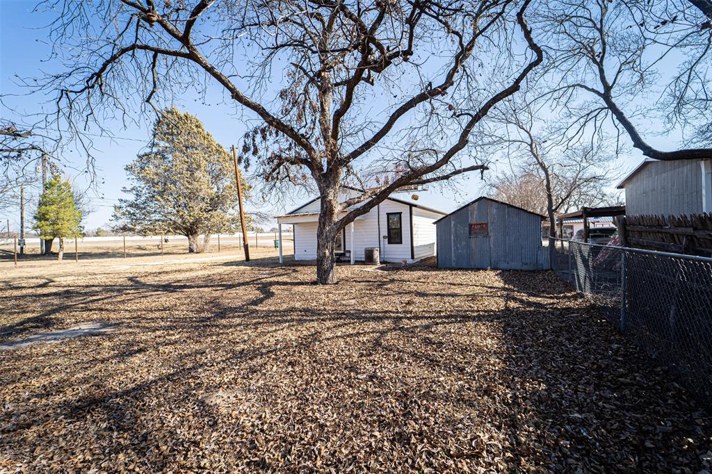 618 Oak Street Clyde, TX 79510 - Photo 39 of 39 a view of a yard covered with snow in front of house
