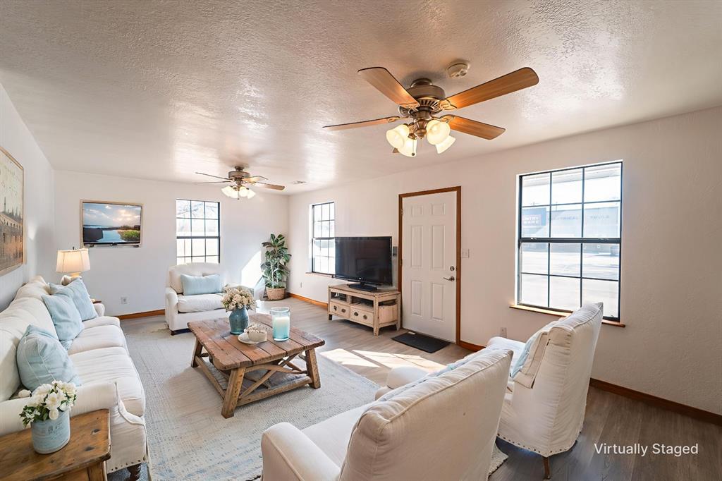 618 Oak Street Clyde, TX 79510 - Photo 4 of 39 a living room with furniture ceiling fan and a window