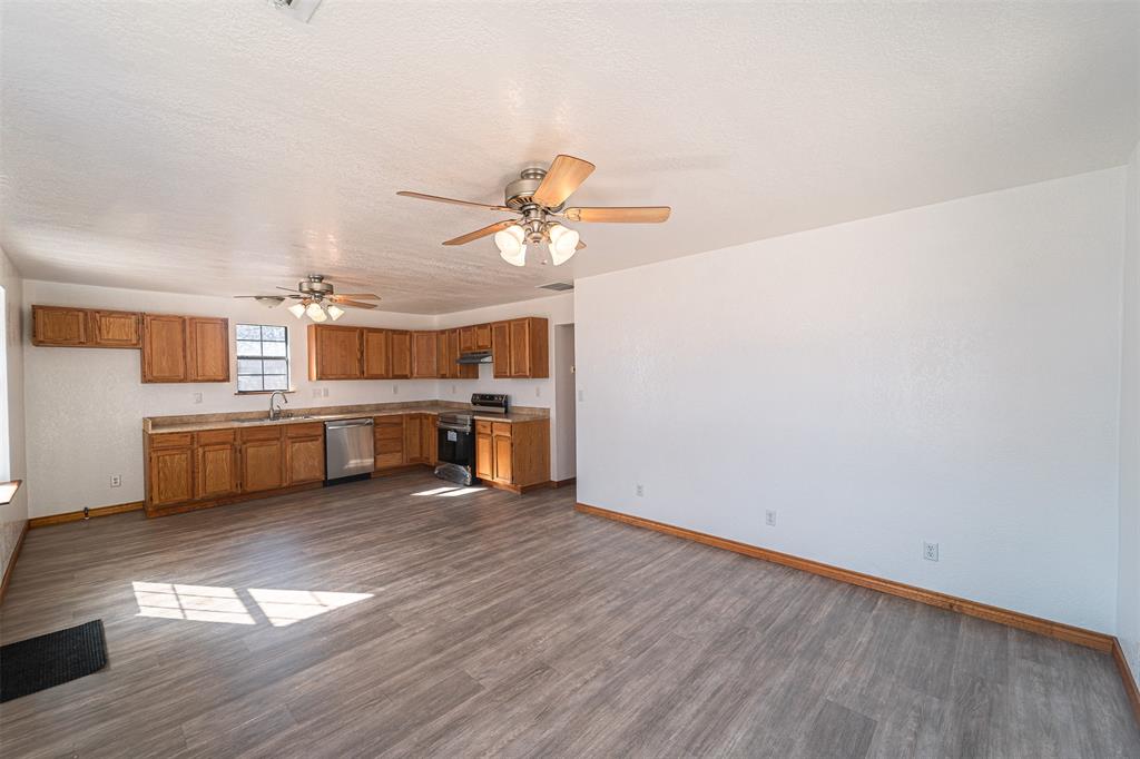 618 Oak Street Clyde, TX 79510 - Photo 8 of 39 a view of a kitchen with stove and cabinets