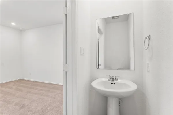 a view of an empty room with a fireplace